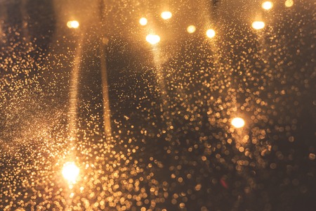 City lights behind glass with raindrops. Autumn.の写真素材