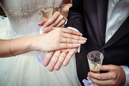 Hands newlywed with gold rings on his right hand. Wedding.の写真素材