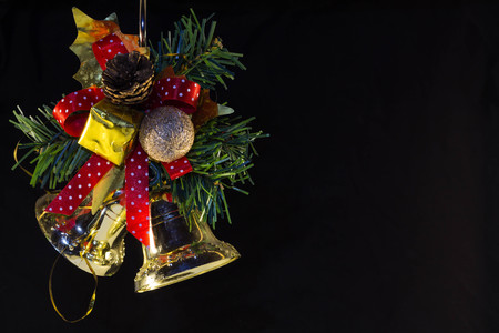 Christmas green branches ate with a gift and bells. Happy NYの写真素材