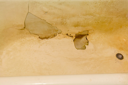 Rusty bath with peeling enamel. Repair is required.の写真素材