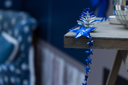 New Year Decorations of blue color lie on the shelf.の写真素材