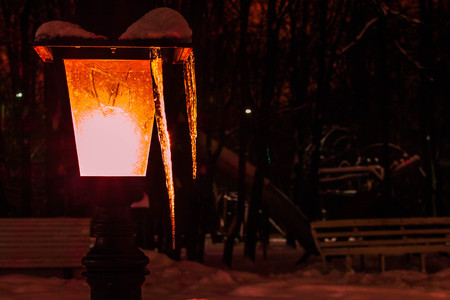 Night lantern with icicles in the winter in the eveningの写真素材