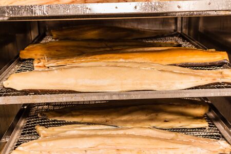 Hot smoked fish. Fish production in progress