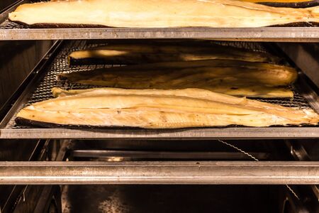 Hot smoked fish. Fish production in progress