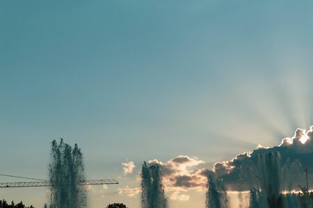 Exhibition fountain VDNH Moscow against the background of the rays of the sun behindの写真素材