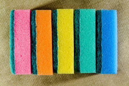 Multi-colored sponges in a row. Microfiber material. Dish washing.の写真素材