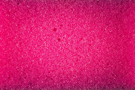 Pink sponge made of microfiber material. Texture, backgroundの写真素材