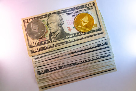 Stacked Ten Dollar Bills With Ethereum Cryptocurrency On Top