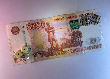A Risky Gamble With Russian Rubles And Dice On White Background