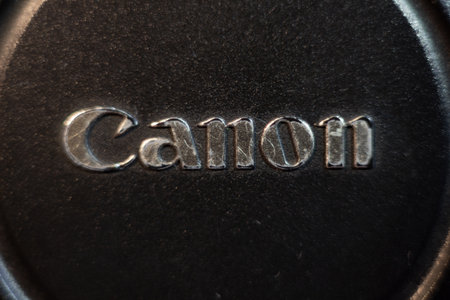 Canon logo on professional camera body a detailed metallic texture equipment technology