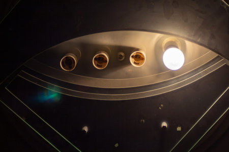 Modern ceiling design with recessed lighting fixtures in dark room interiorの写真素材