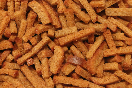 Golden crunchy breadcrumbs texture for culinary backgrounds and food design