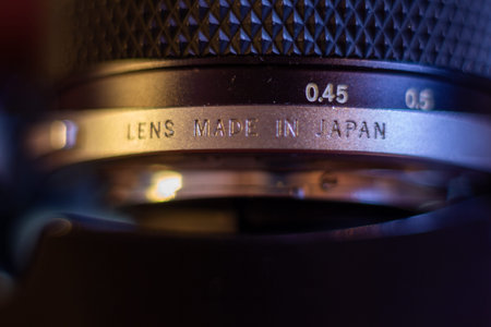 High quality camera lens detail with text made in japan and aperture markings