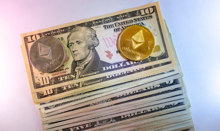 Cryptocurrency And Us Dollar Bills Stack With Ethereum Coin On Top