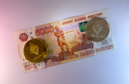 Russian Ruble Banknote And Ethereum Cryptocurrency Coin On Dark Backgroundのeditorial素材