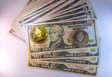 Cryptocurrency And Ten Dollar Bills Stacked With Golden Coins On Topのeditorial素材