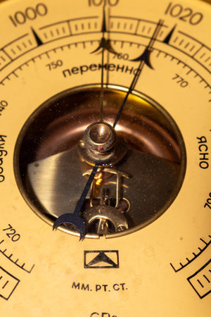 Barometric pressure gauge detail showing atmospheric measurement instrument antique equipment...