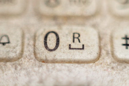 Old keyboard buttons with letter o and symbol r detail macro view