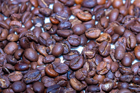 Aromatic roasted coffee beans background texture for gourmet drink and freshness concept