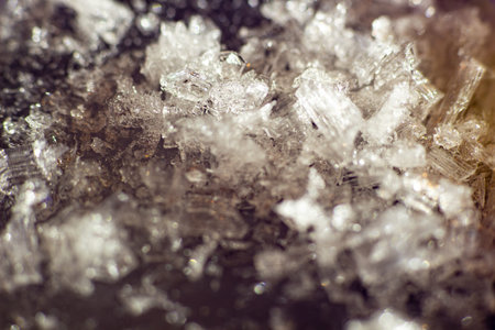Frozen texture delicate ice crystals forming beautiful winter patterns on dark background