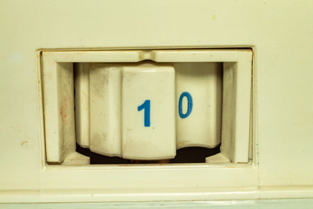 Detailed view of an old mechanical counter displaying the number ten