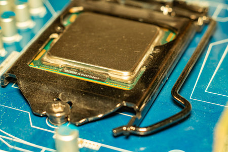 A detailed view of a modern computer processor installed on the motherboard with silver components