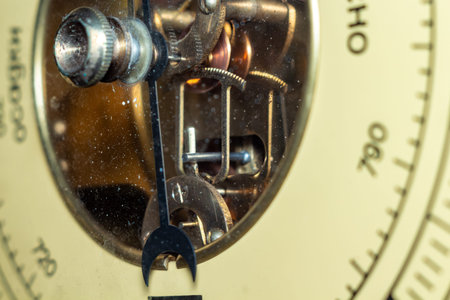 Antique barometer mechanism detailed view showing intricate gears and internal structure
