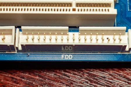 Detailed view of old ide and floppy disk connectors on a motherboard circuit board