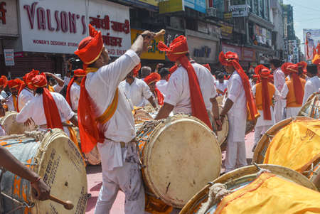 Pune, India - September 4, 2017: Dhol tasha pathak playing dhol on the streets of pune on the...