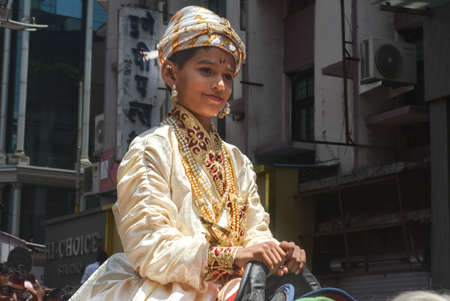 Pune, India - September 4, 2017: Small kid wearing a costume of chattrapati shivaji maharaj in the rally of ganpati visarjan festival / Anant chaturdashi Festival celebration in pune.のeditorial素材