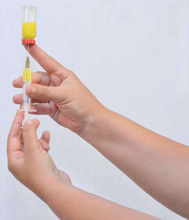 On white background, are made hands, medication, syringe の写真素材