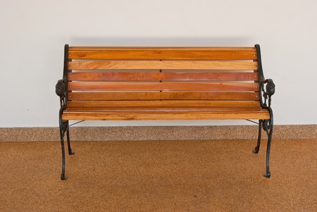 Lonely bench front wallの写真素材