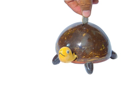 Saving box with turtle statueの写真素材