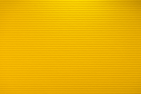 close up of yellow paper texture with embossed linesの写真素材
