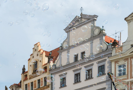 soap bubbles on the background of old houses in Prague
