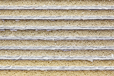 Close-up picture showing stack of cardboard with foam rubberの写真素材