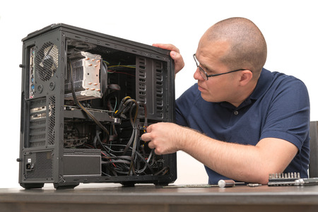 Computer Technician repairing computer systemの写真素材