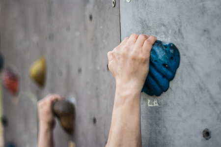 Close-up of asian male Climbing focus on handsの写真素材