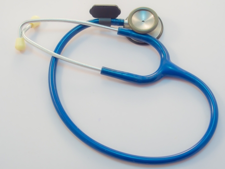 Blue stethoscope isolated on whiteの写真素材