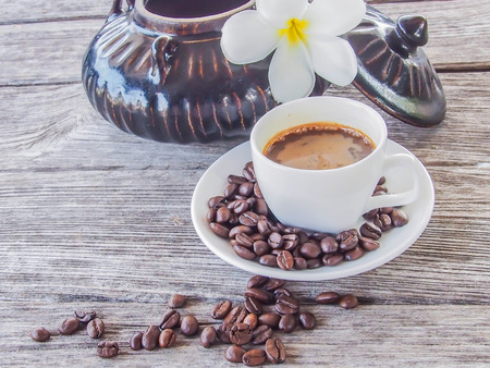 Coffee cup and saucer on a wooden tableの写真素材