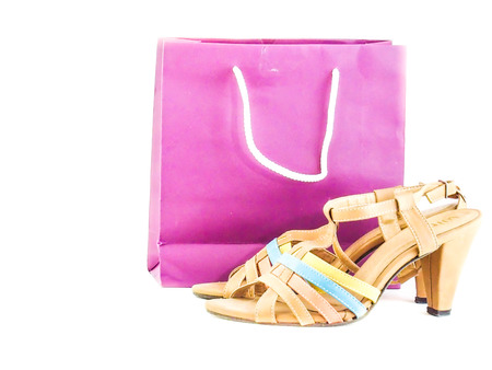 Sexy fashionable shoes, shopping bag isolated on white background の写真素材