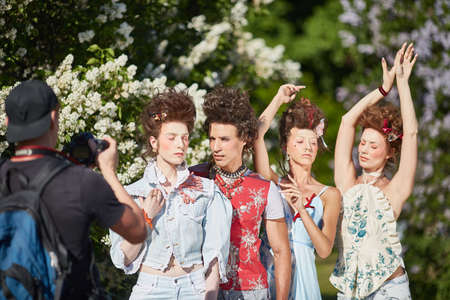 MOSCOW, RUSSIA - 19 MAY, 2019 Fashionable hipster girls and a guy posing for a photographer in...