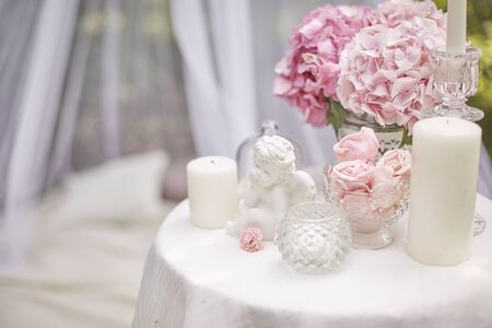 picnic in the forest with sweets, flowers hydrangea and candles. Copy space.の写真素材