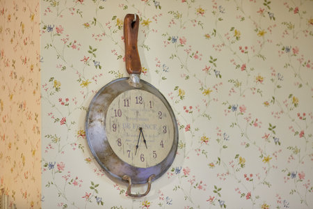 Decorations of chic.vintage style. Kitchen clock on the wall. the style of shabby chicの写真素材