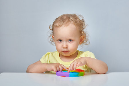 Popular Anti stress toy. Child Playing With The Fidget Toy. Happy childhood, popular educational games.の写真素材