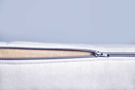 Orthopedic mattress with an unbuttoned removable cover. Copy space.の写真素材