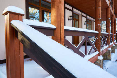 railing and part of the stairs with snowdrifts after a snowfall.の写真素材