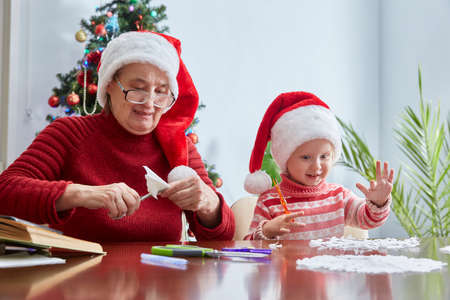 Family traditions of creating and decorating a New Years home decor for Christmas.の写真素材