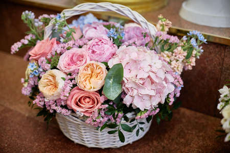 large basket with flowers. Hydrangea, ranunculus, roses, staticeの写真素材
