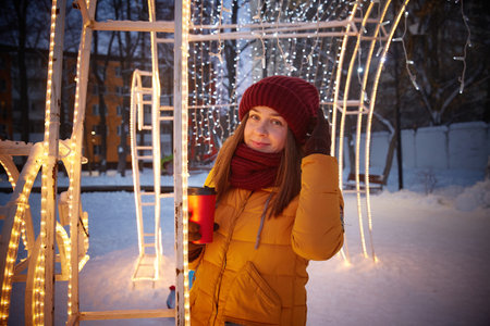 New Year or Christmas evening walk of a young womanの写真素材